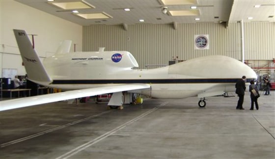A NASA Global Hawk robotic jet sits in a hangar at Dryden Flight Research Center in Edwards Air Force Base, Calif., on Tuesday. The Air Force turned over to NASA three Global Hawks, which were designed for military reconnaissance but equipped with science sensors for conducting atmospheric research over the Pacific.